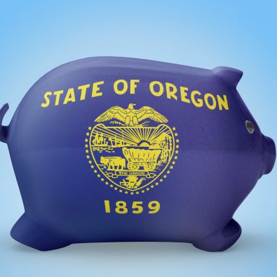 Side view of a piggy bank with the flag design of Oregon.(series)